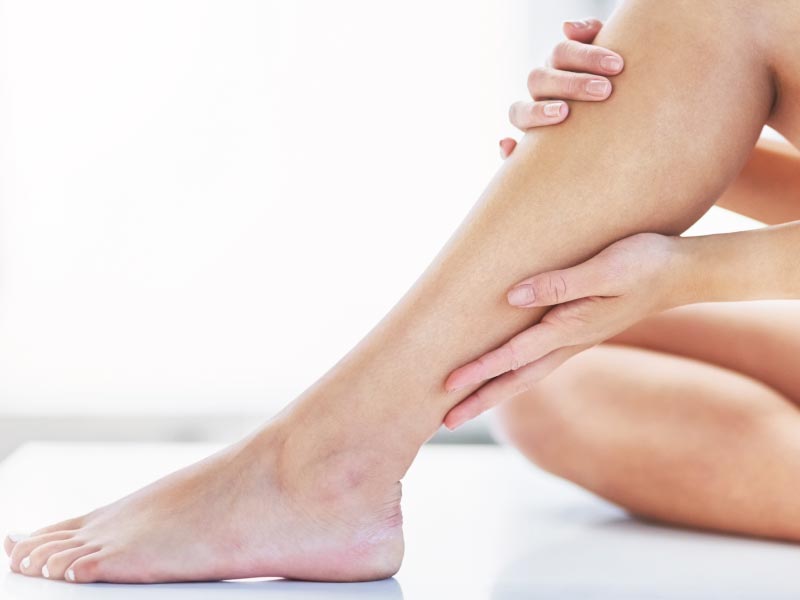 Hair on a female leg close up. The problem of hairy legs in women